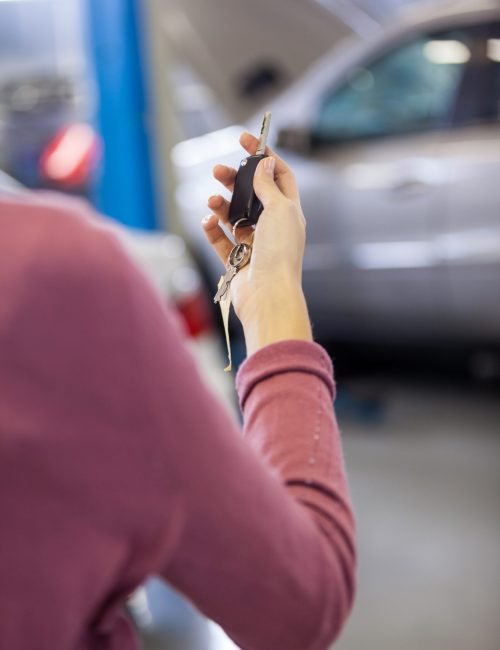 Customer holding keys at the storage garage